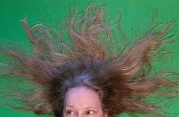 Woman with long hair splayed out around her head